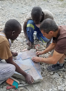 Artist Itai Chazan at work outlining his art piece.