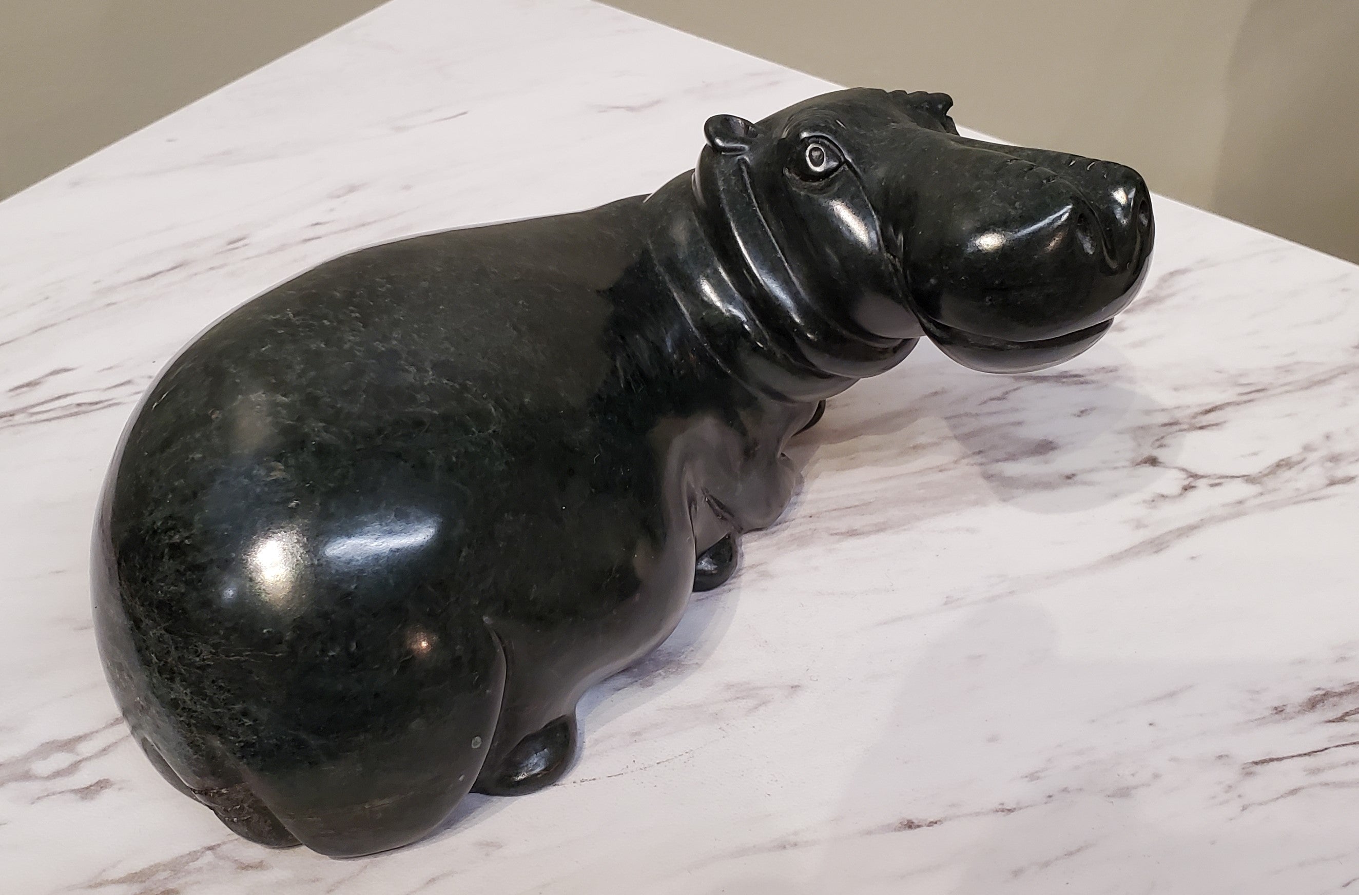 Lounging Hippo. Color Range: Black.