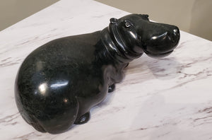 Lounging Hippo. Color Range: Black.