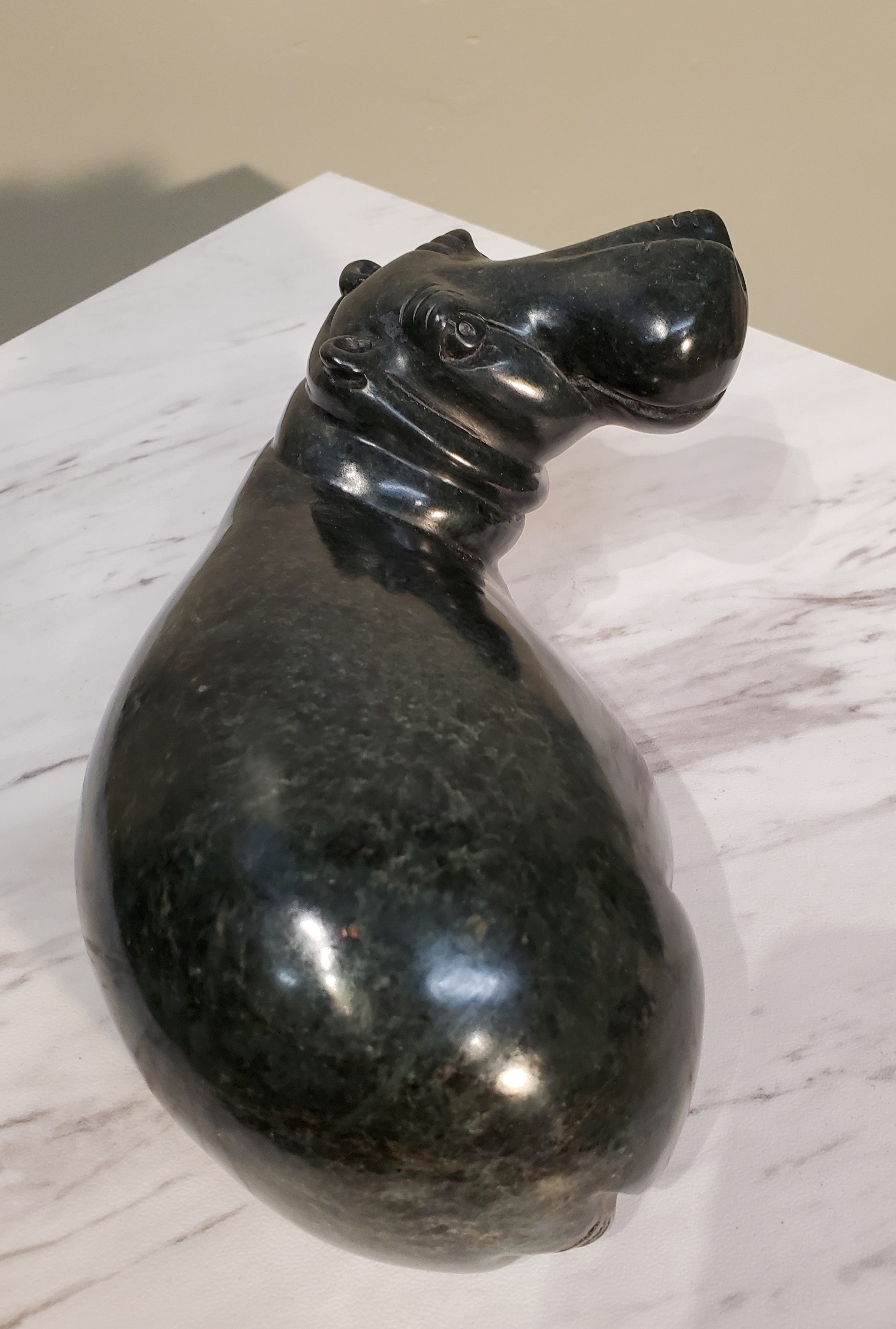 Lounging Hippo. Color Range: Black.