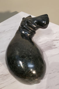 Lounging Hippo. Color Range: Black.