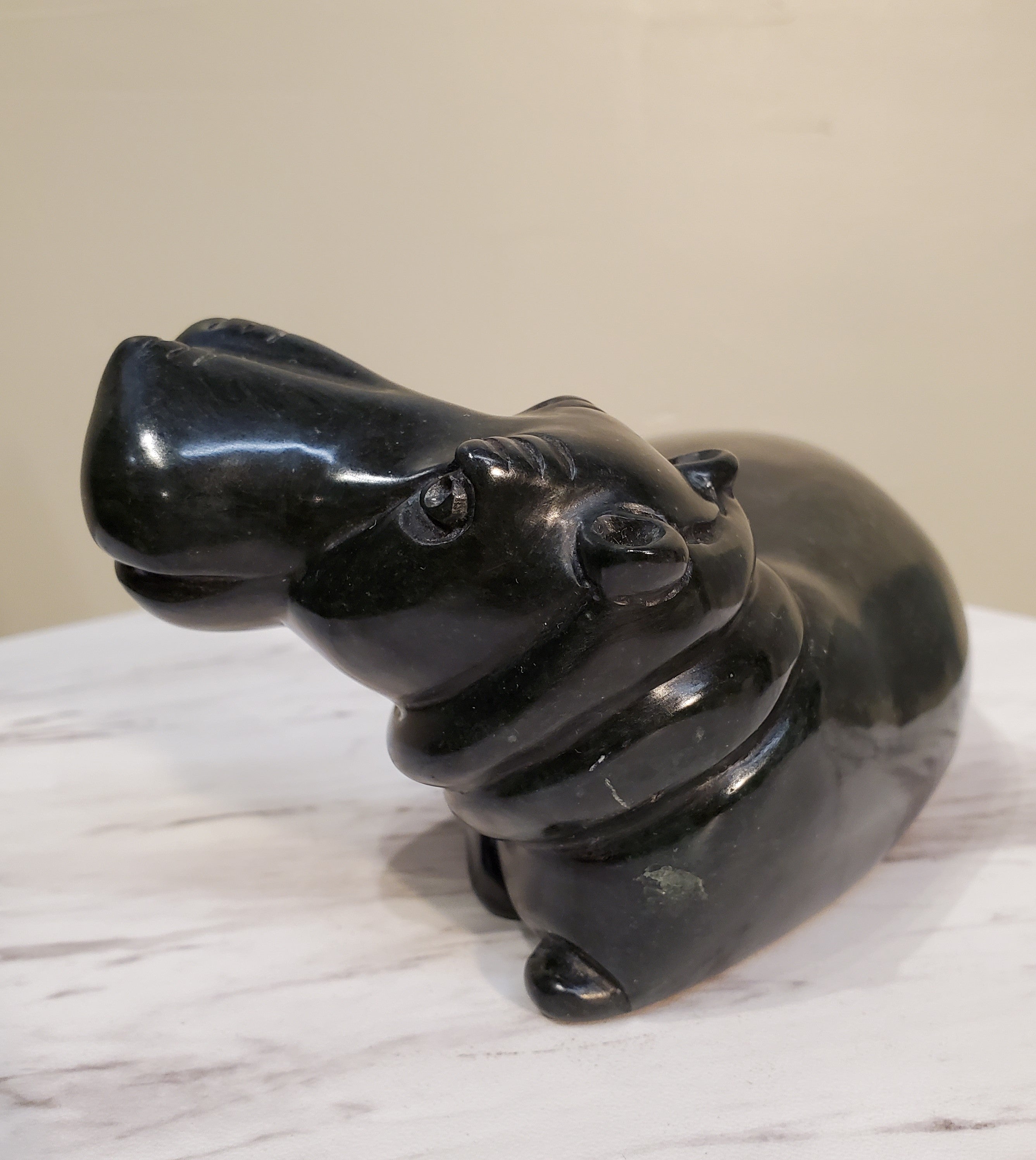 Lounging Hippo. Color Range: Black.