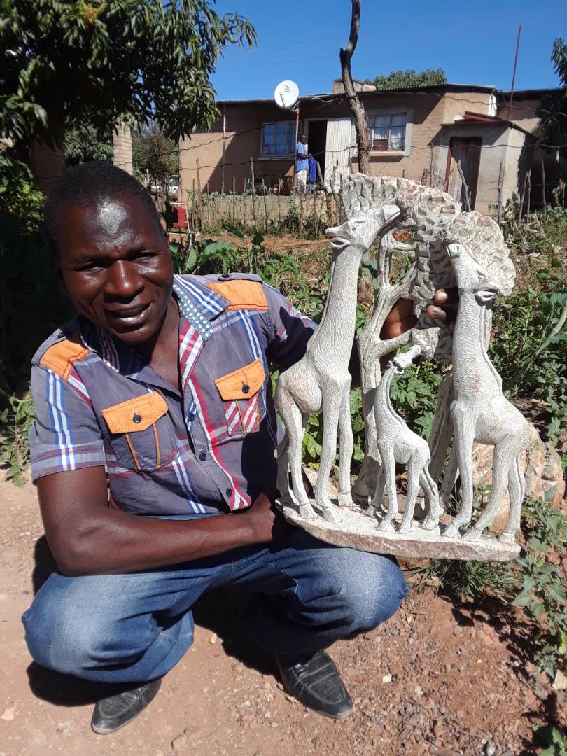 The artist Loid Ngwaru and his work. 