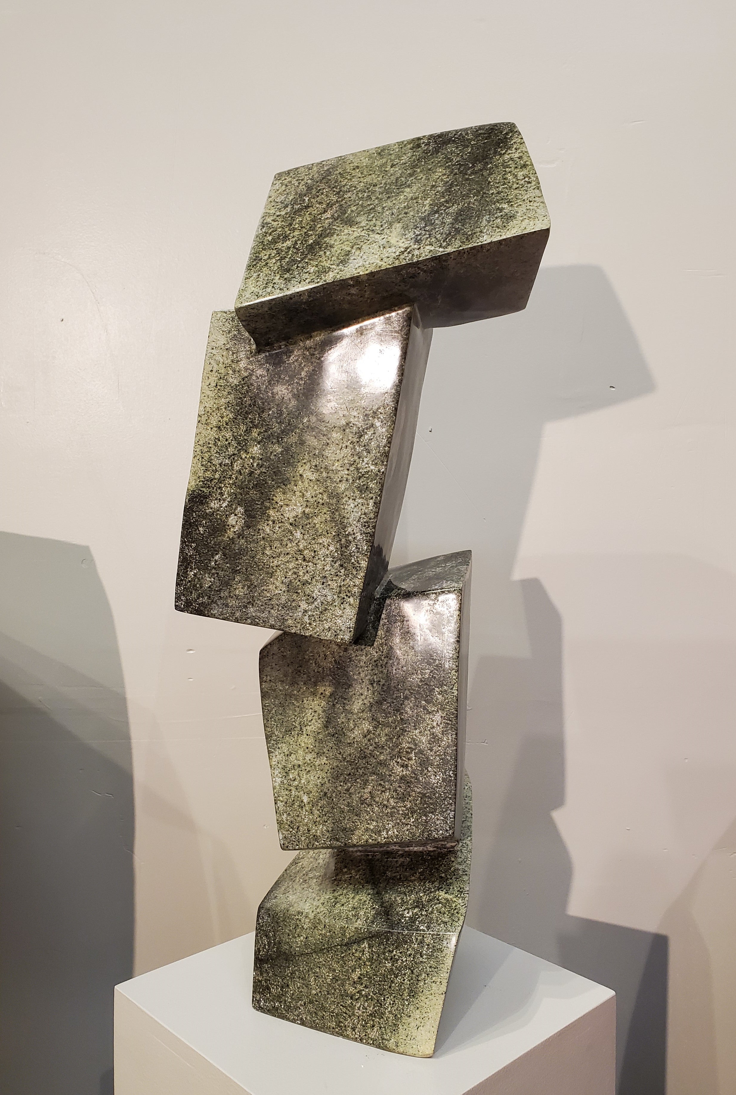 Balancing Act. Color Range: Green, Black, Cream.