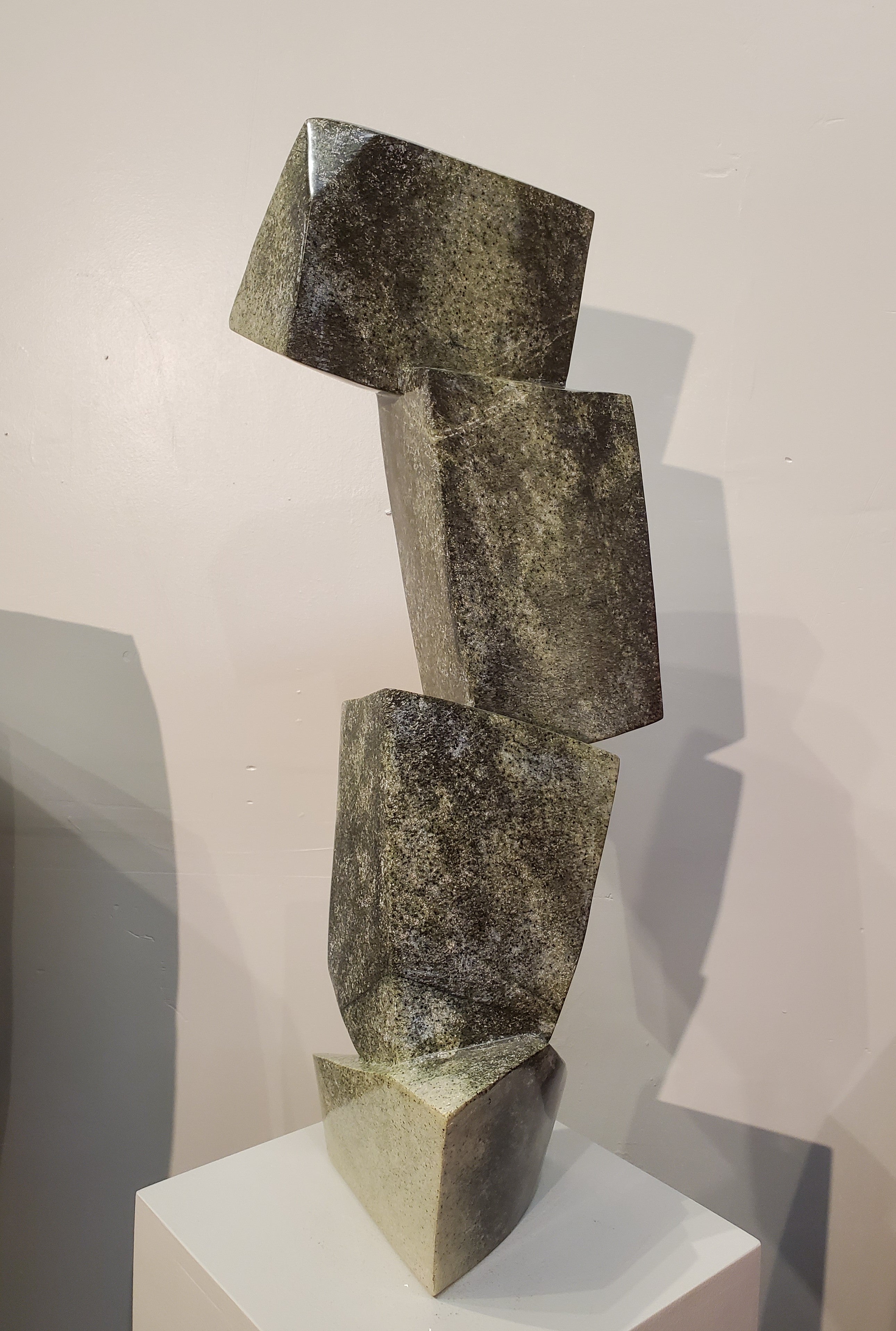 Balancing Act. Color Range: Green, Black, Cream.