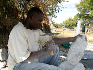Artist Peter Chidzonga at work creating a beautiful stone sculpture. 